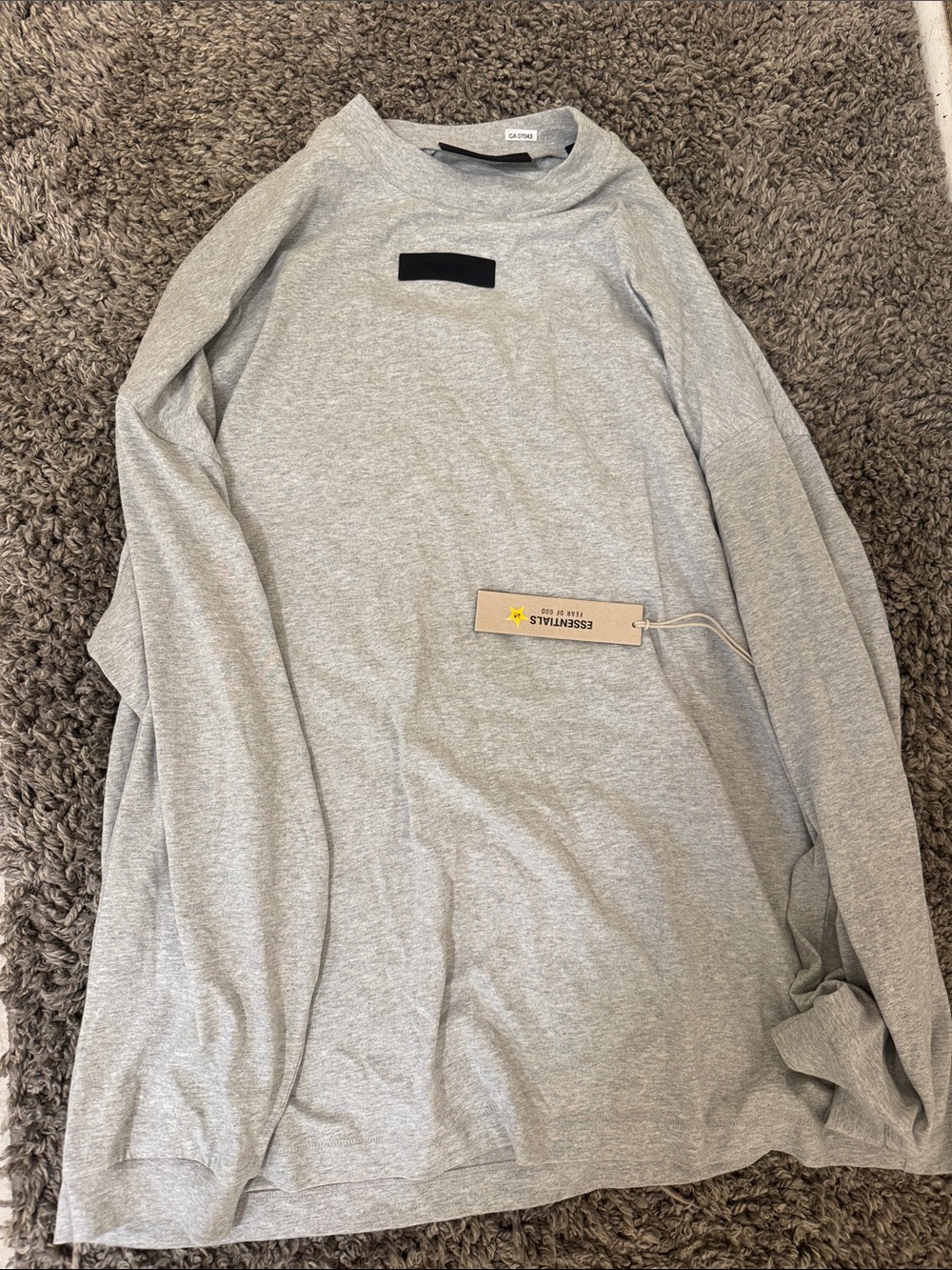 Brand new Essentials Men’s Long Sleeve Shirt in Heather Gray with Black Patch